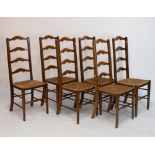 Set of six early 20th Century rush-seated beech or fruitwood ladder back dining chairs