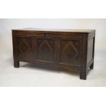 17th/18th Century oak coffer having hinged cover and triple panel front, 126cm wide x 52cm deep x