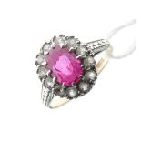 9ct gold cluster ring set central faceted ruby-coloured stone within a border of white stones, 2.
