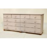 Painted lilac pine chest of four short over two banks of three long drawers, 152cm wide x 40cm