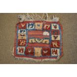 Two small Middle Eastern wool rugs, comprising: a Shiraz, 60cm x 75cm, and a Sirjan, 51cm x 81cm,