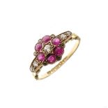George V 18ct gold, ruby and diamond cluster ring of flowerhead design with central diamond, six