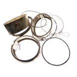 Four various silver snap bangles and four various white metal bangles, 5toz approx