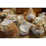 Two extensive eggshell hand painted porcelain tea sets
