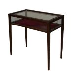 Mahogany table cabinet having glazed top and sides, raised on slender square tapered supports,