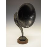 Vintage 'Brown' aluminium gramophone horn on circular wooden plinth, 54cm high