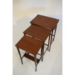 Nest of three Edwardian mahogany and string inlaid occasional tables, 49cm wide