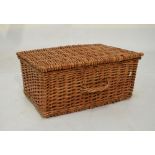 Two seagrass boxes with covers and a wicker hamper