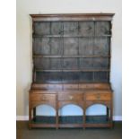 18th/19th Century oak dresser with plate rack over, the base fitted five short drawers above three