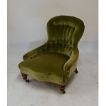 Victorian walnut salon chair having green button back upholstery, raised on turned supports fitted