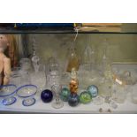 Assorted glassware to include; decanters, facet-stem ale flute, paperweights, etc