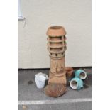 Large stoneware chimney pot of vented design, 94cm high, together with a selection of garden pots