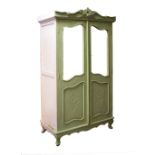 Continental painted pine two door wardrobe having carved cresting, raised on cabriole supports,