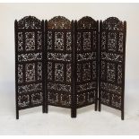 South East Asian carved and pierced hardwood four-fold screen having grape and vine decoration,