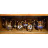 Nine various 19th/20th Century lustre decorated jugs