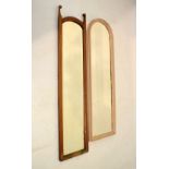 Two slender framed mirrors