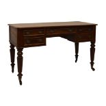 19th Century mahogany writing table, the moulded oblong top over long frieze drawer between two