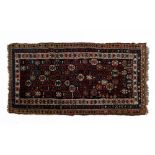 Small early to mid 20th Century Middle Eastern wool rug, the indigo-ground field filled with
