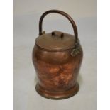 Late 19th Century copper baluster shaped vessel having hinged loop handle and cover, 50cm with
