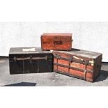 Three vintage trunks, all with carry handles, the largest measuring 90cm wide