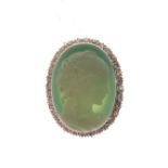 18ct gold, diamond and glass cameo pendant brooch, the oval sea-green glass cameo depicting a female