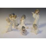 Group of Lladro porcelain figurines of young angels, tallest 21cm high