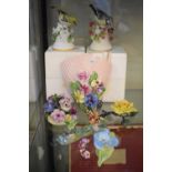 Mixed group of ceramic floral figurines to include Sylvac floral wall pocket, Denton china hand