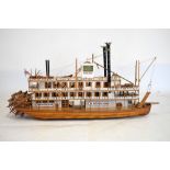 Wooden model of a Mississippi type paddle steamer, approximately 110cm long