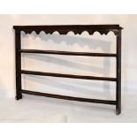 18th Century pine plate rack with wavy valance over three shelves, 156cm wide x 109cm high, together