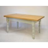 Modern light oak-topped dining table, on four turned painted supports, 100cm x 150cm x 79cm high