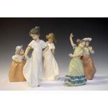 Four Nao porcelain figures - Flower Girl and Two girls in white dresses, together with Lladro