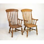 Two beech framed Thames Valley high-back armchairs having elm hard seats