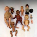 Small group of vintage 20th Century dolls and doll parts to include loose limbs, bisque headed