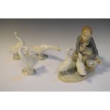 Lladro porcelain figurine of a girl feeding ducks, together with three other ducks