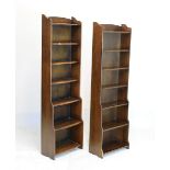 Matched pair of oak finish waterfall bookcases, 47cm wide x 160cm high x 24cm deep