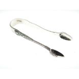 Pair of Victorian Exeter silver sugar tongs with anthemion-decorated grips and floral decoration