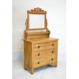 Early 20th Century stripped pine dressing chest, with rectangular mirror plate over trinket shelf,
