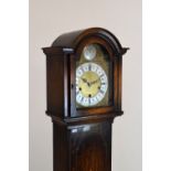 Early to mid 20th Century oak-cased chiming grandmother clock, with 7.5-inch brass dial and silvered