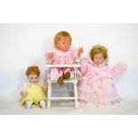 Assorted collection of plastic and bisque headed dolls, in various clothes, one of which in white