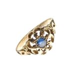 Yellow metal dress ring set central sapphire-coloured blue stone within pierced border, hallmarks