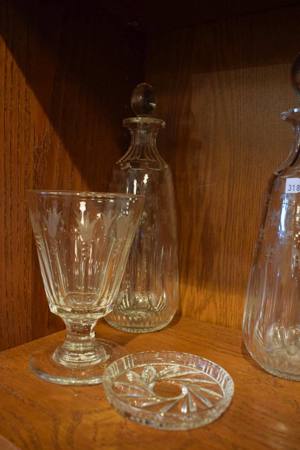 Set of three cut glass decanters having fleur-de-lys engraved decoration, 26.5cm high a glass - Image 2 of 3