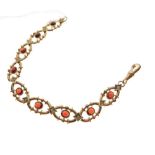 Yellow metal bracelet set red garnet-coloured oval cabochons, stamped 9ct, 17.8g gross approx