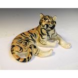 USSR/Russian porcelain figurine of a recumbent tiger, stamped to the underside 'Made Russia', 28cm