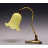 Art Nouveau-style brass and milk glass table lamp with pale yellow glass bell shaped shade, 33cm