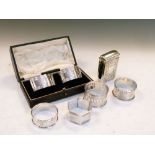 Six assorted silver napkin rings to include; a cased pair, Birmingham 1926, together with an
