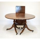 Reproduction mahogany twin pillar dining table in the Regency taste, with D-ends and single