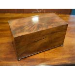 19th Century flame mahogany rectangular tea caddy, the hinged cover revealing cut glass sugar bowl