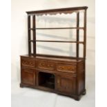 Antique oak dresser and rack, part 18th Century, with moulded cornice and wavy valance over three