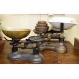 Set of late Victorian/Edwardian grocer's scales with enamel pan on green-painted base, together with