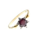 Yellow metal, white sapphire and red garnet-coloured stone dress ring of cluster design, shank